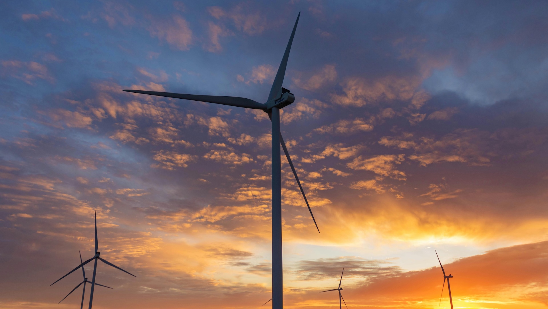 Wind turbines with clouds during sunset