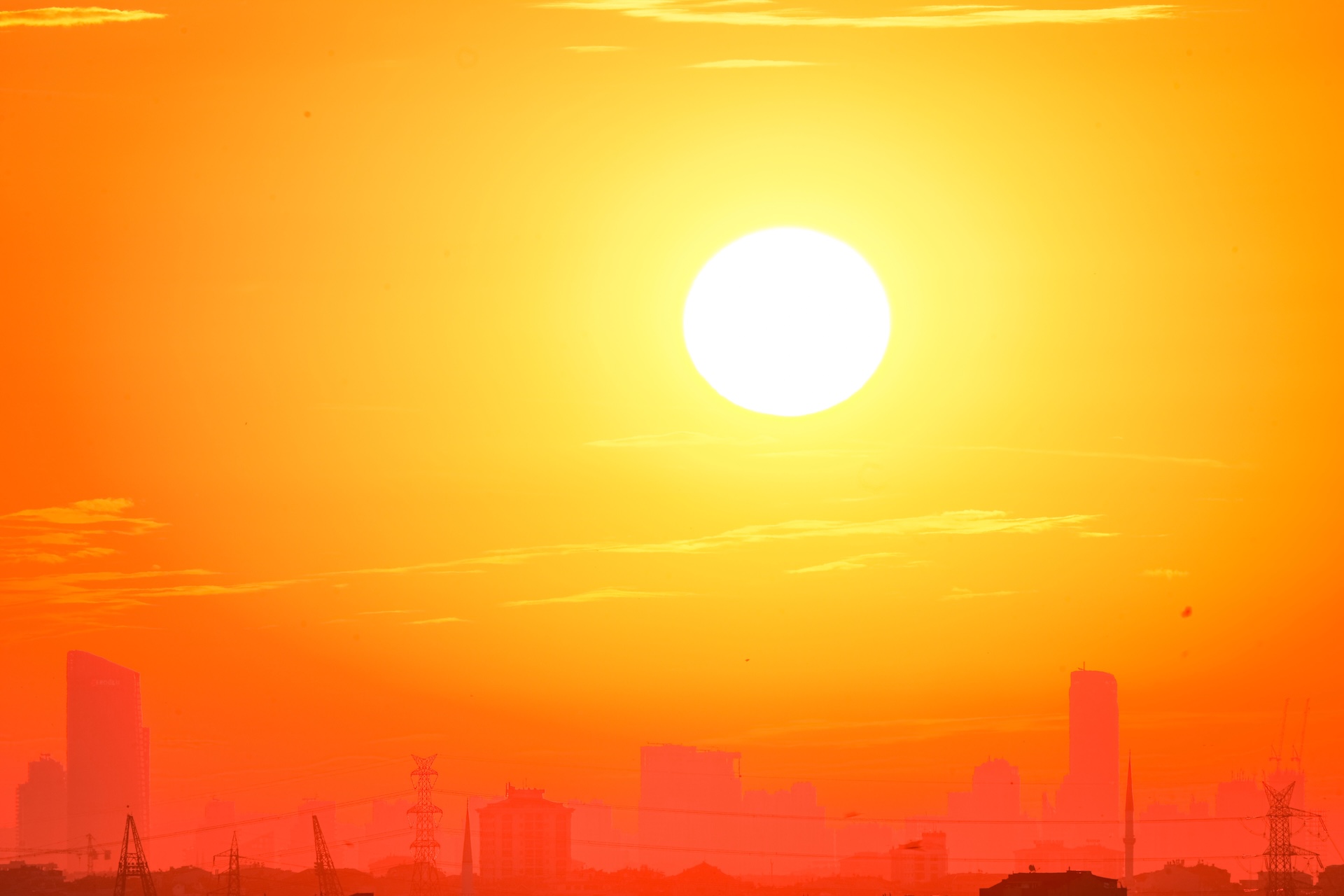 City skyline with blazing sun